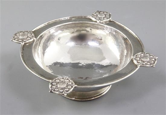 A George V Arts & Crafts silver raised circular dish, by Omar Ramsden, Dia (to Rose motifs) 165mm, weight 7.2ozs/226grms